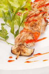 Chicken kebab with tomato sauce