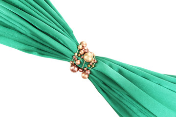 Green cloth tied with beads isolated on white