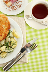 Roast chicken cutlet with boiled potatoes and  vegetables, cup