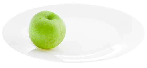 green apple on white plate