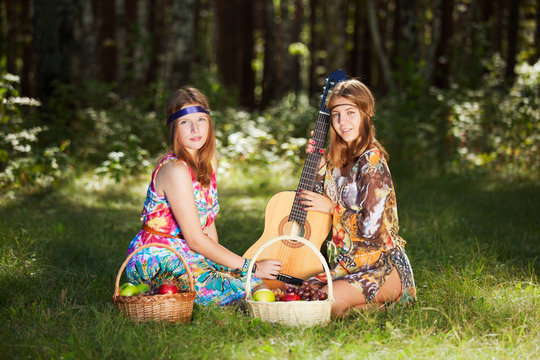 Hippie girls with a fruit basket