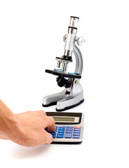 Microscope, calculator isolated on white