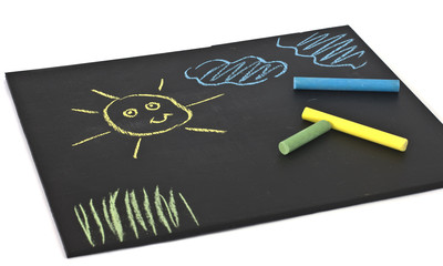Child's drawings on blackboard  isolated on white