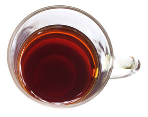 Tea liquor on a transparent cup over white background