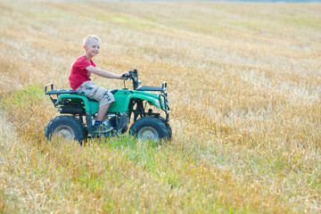 Boy riding a quad bike