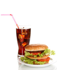 Big and tasty hamburger on plate with cola isolated on white