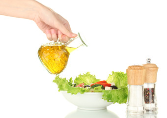 Greek salad seasoned with olive oil on white background