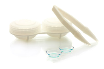 contact lenses, containers and tweezers isolated on white