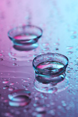 contact lenses, on pink-blue background