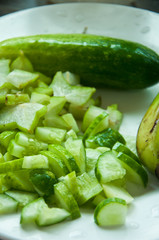 sliced cucumber and star apple in dish