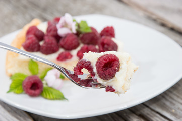 Tart on a plate against wooden background