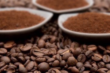 Ground coffee on coffe beans