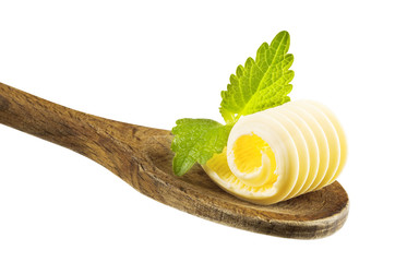 Butter curl on wooden spoon