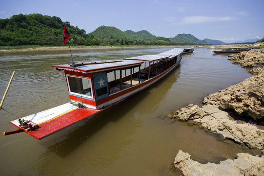 Boat on Mekong river, border crossing, checkpoint