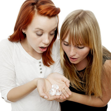 young beautiful red and blond haired girls gape about diamonds