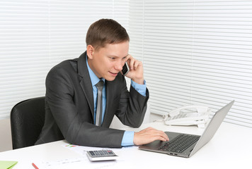 Businessman talking on the phone in office