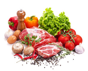 Still life with raw pork meat and fresh vegetables