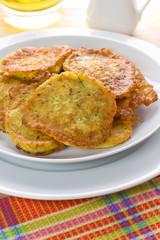 Homemade squash pancakes on the white plate