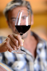 Winemakers in cellar using electronic tablet