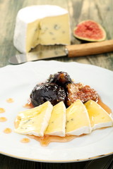 Figs cooked in honey and soft cheese.