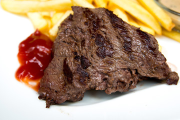 juicy steak beef meat with tomato and french fries