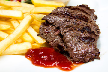 juicy steak beef meat with tomato and french fries