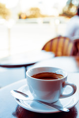 wonderful white cup of hot coffee on table