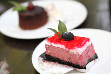 raspberry cake on wood background