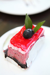 raspberry cake on wood background
