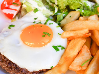 Egg and fries - classical english breakfast with egg and fries