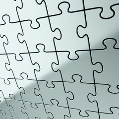 Puzzle jigsaw background made of shiny metal pieces