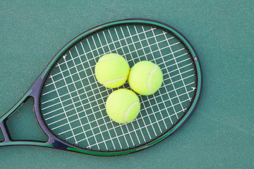 Tennis court with ball and racket