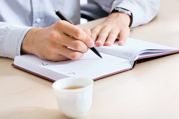 Hand writing in a notepad