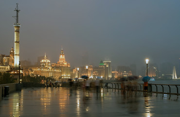 Naklejka premium Image of Bund in Shanghai at night and rain, China