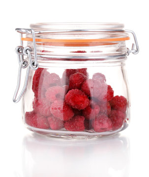 Raspberries in jar isolated on white