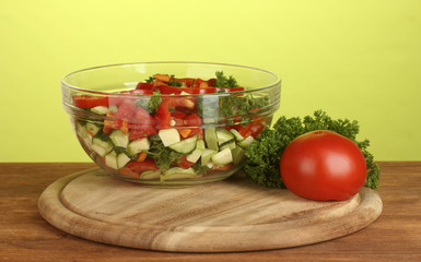 Fresh salad on green background