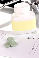 Pharmacist prescription with pills isolated on white