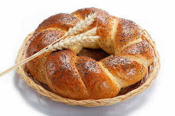 A fresh loaf of bread sprinkle with poppy seeds isolated on whit
