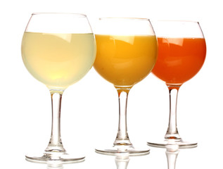 Tropical juices in glasses isolated on white