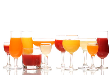 Tropical juices in glasses isolated on white