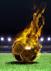 Naklejka premium fiery soccer ball on field