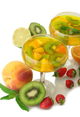 punch in glasses with fruits, isolated on white