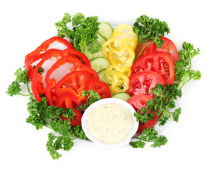 Chopped vegetables and sauce on plate isolated on white