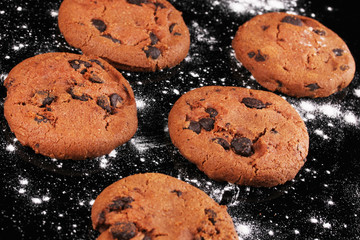 Chocolate chips cookies isolated on black