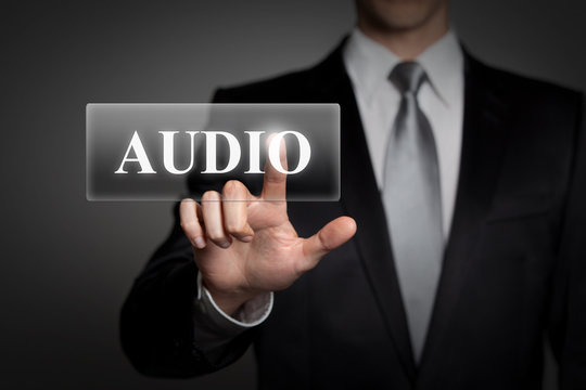 businessman pressing virtual button - audio
