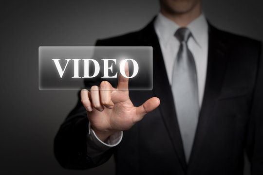 businessman pressing virtual button - video