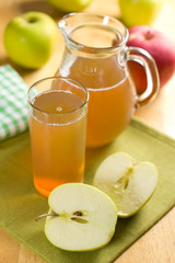 Apple juice and fresh fruits with leaves