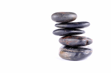 black zen stones on white backgroundt, soft shadows