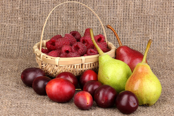 ripe sweet fruits and berries on sackcloth