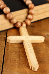the Wooden rosary beads and holy bible